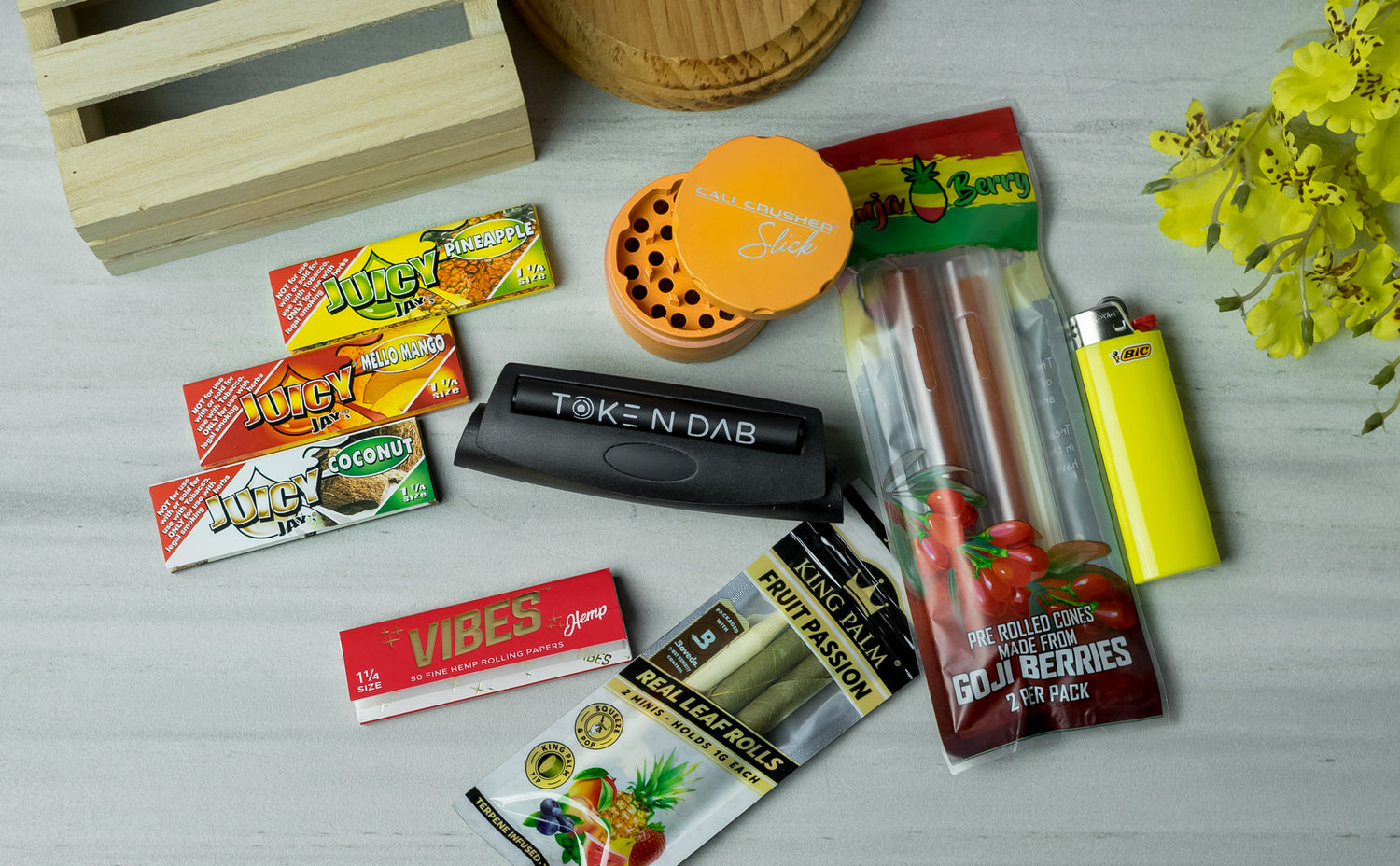 100 Pre-Rolled Cones, a 4 part metal grinder and a Wooden Rolling Tray Set